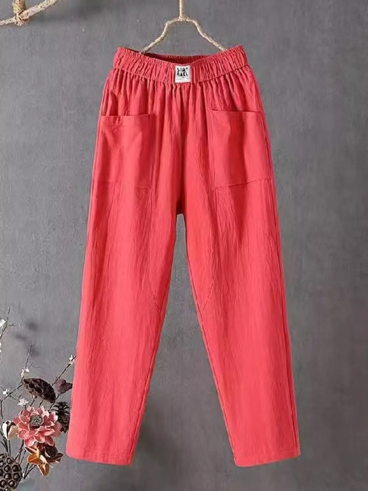 Linen-blend harem pants, coral hanging front