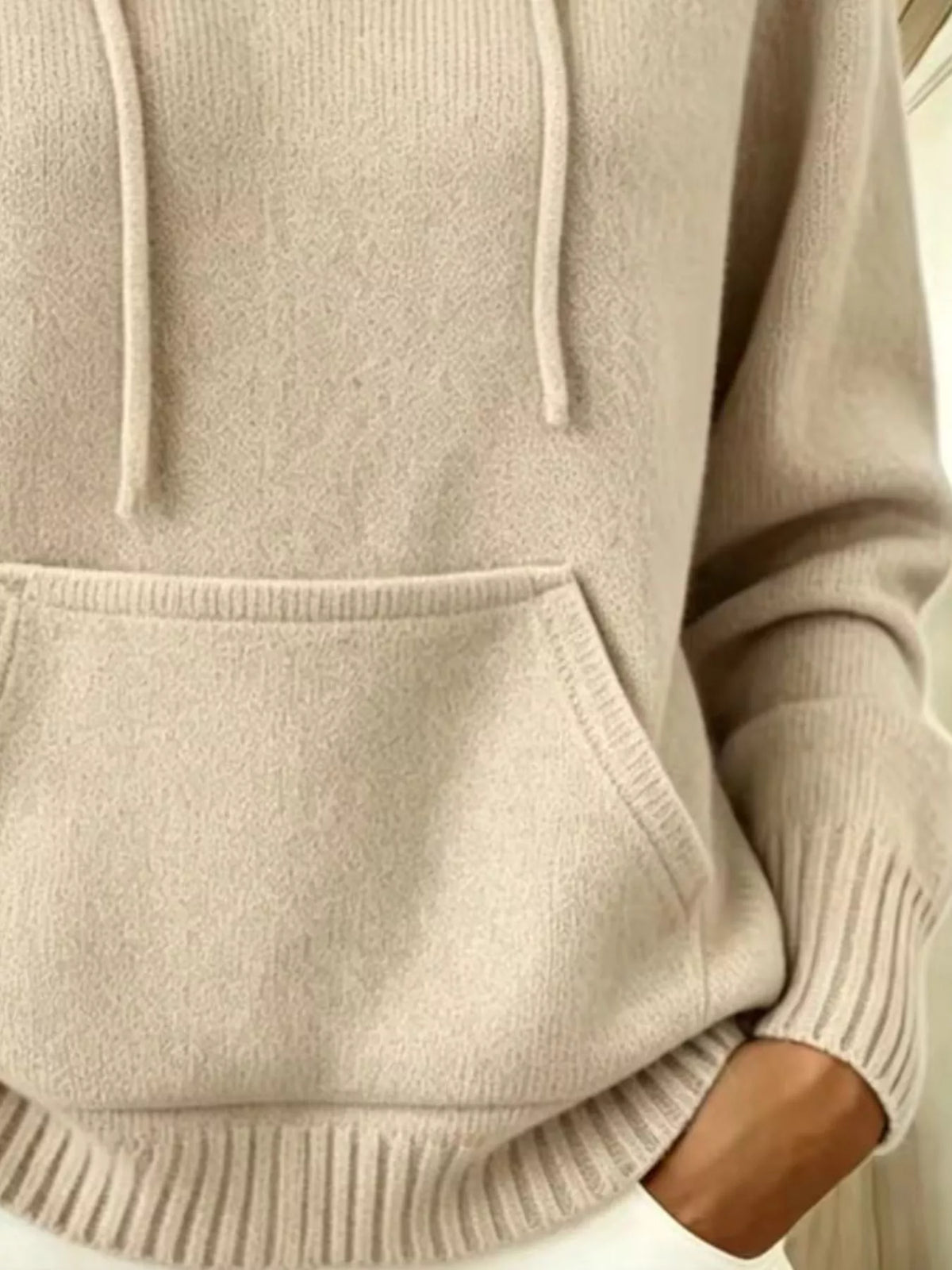 Women's Drawstring Kangaroo Pocket Hooded Sweater in beige — pocket detail view