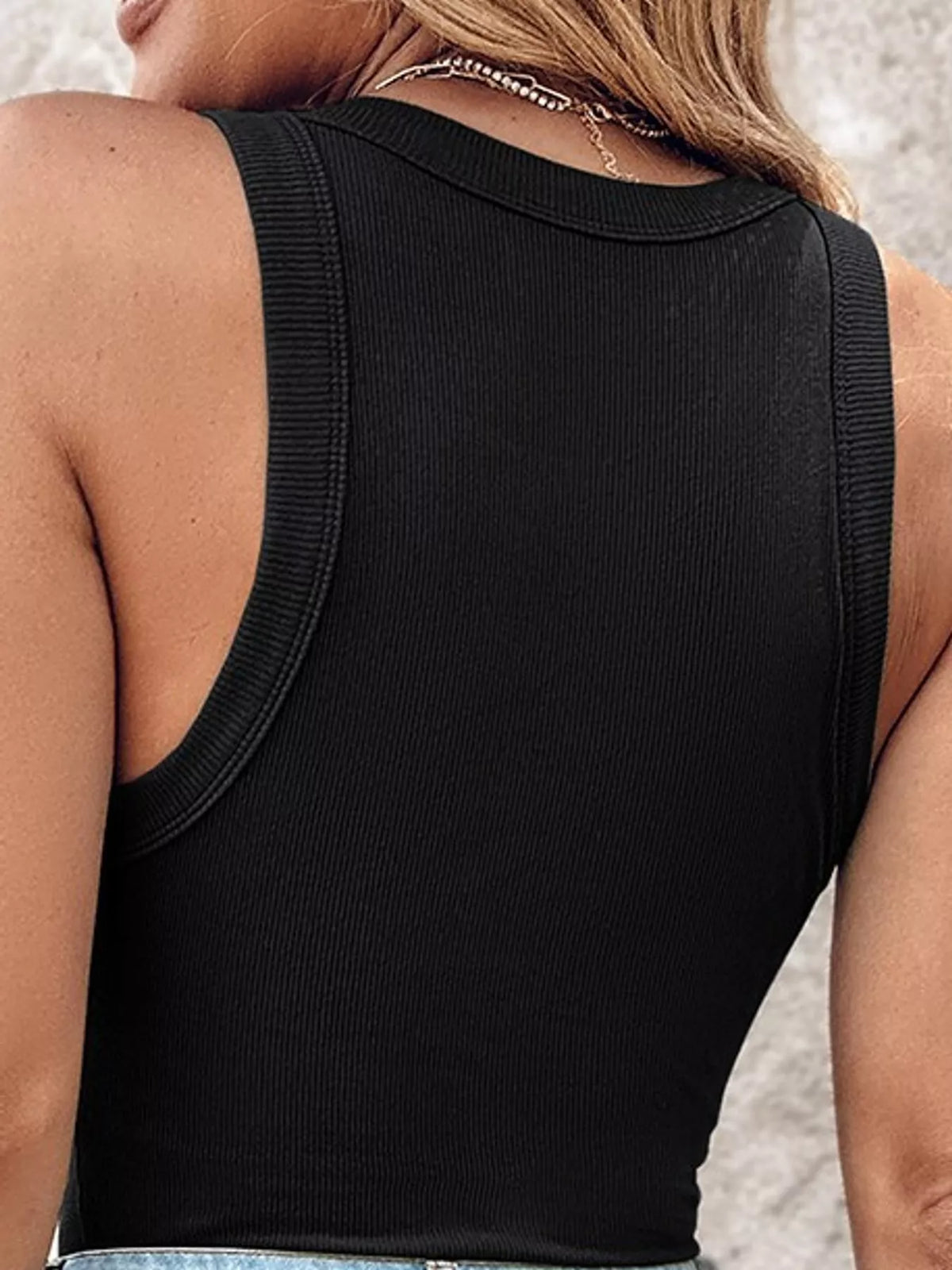 Black ribbed knit slim fit tank top, back view