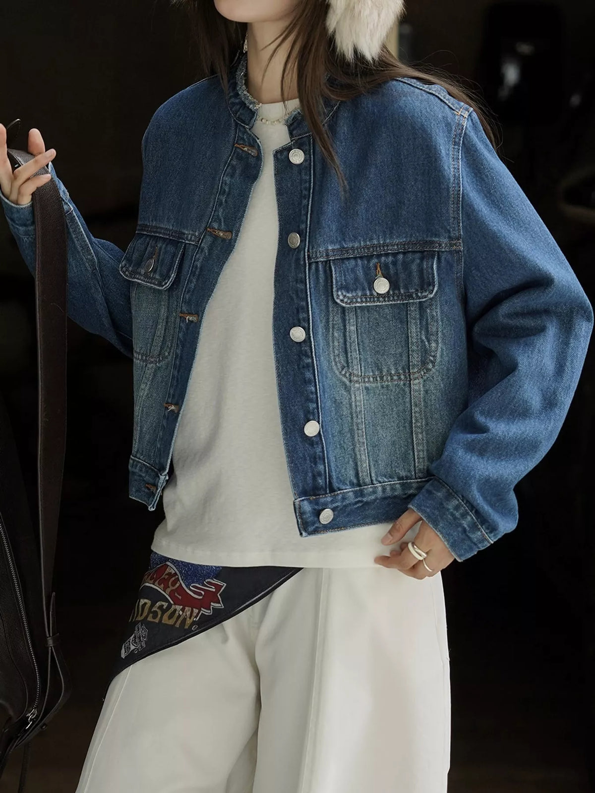 Blue button-up cropped denim jacket — front view