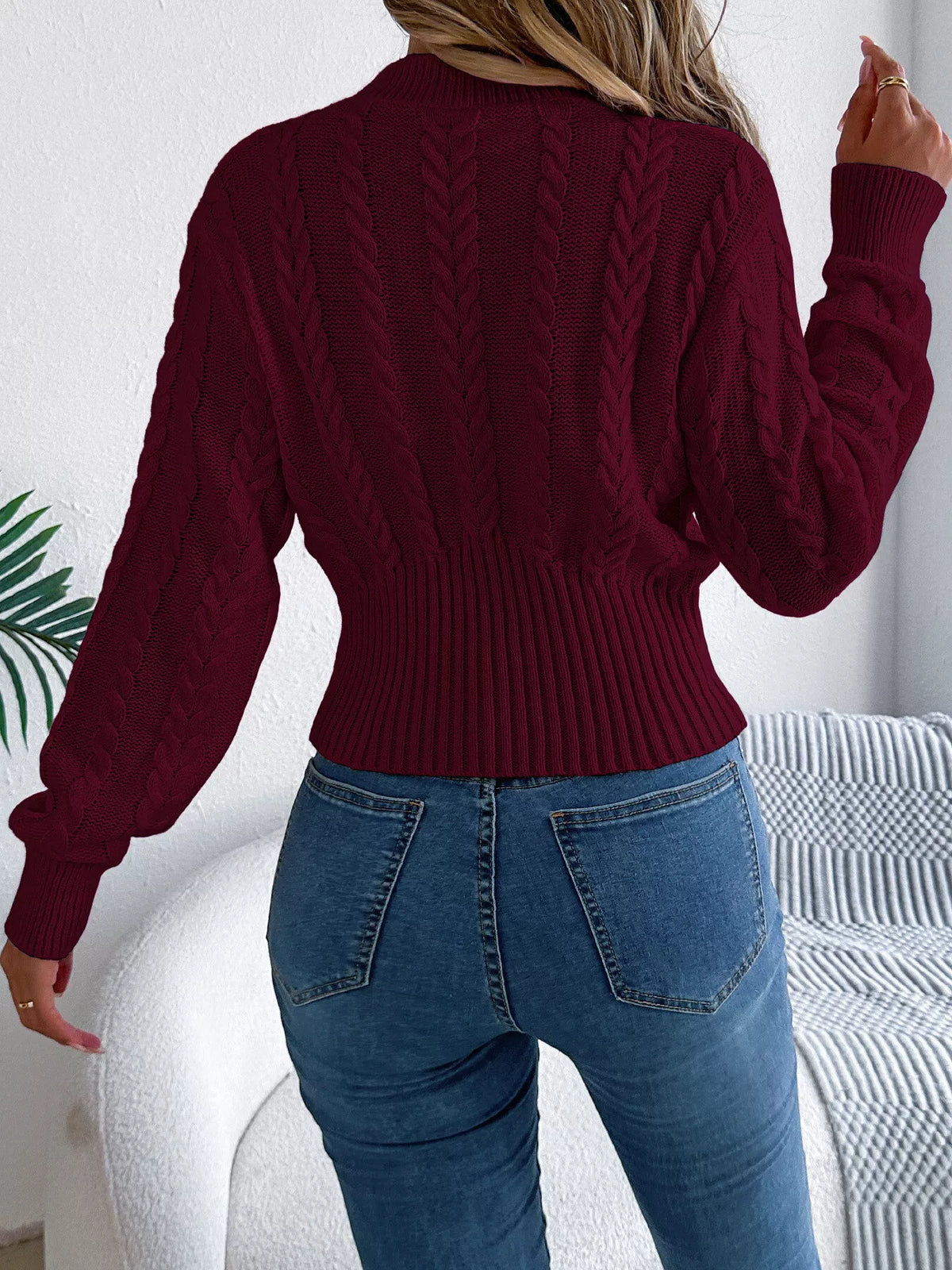 Burgundy cable knit mock neck sweater, back view