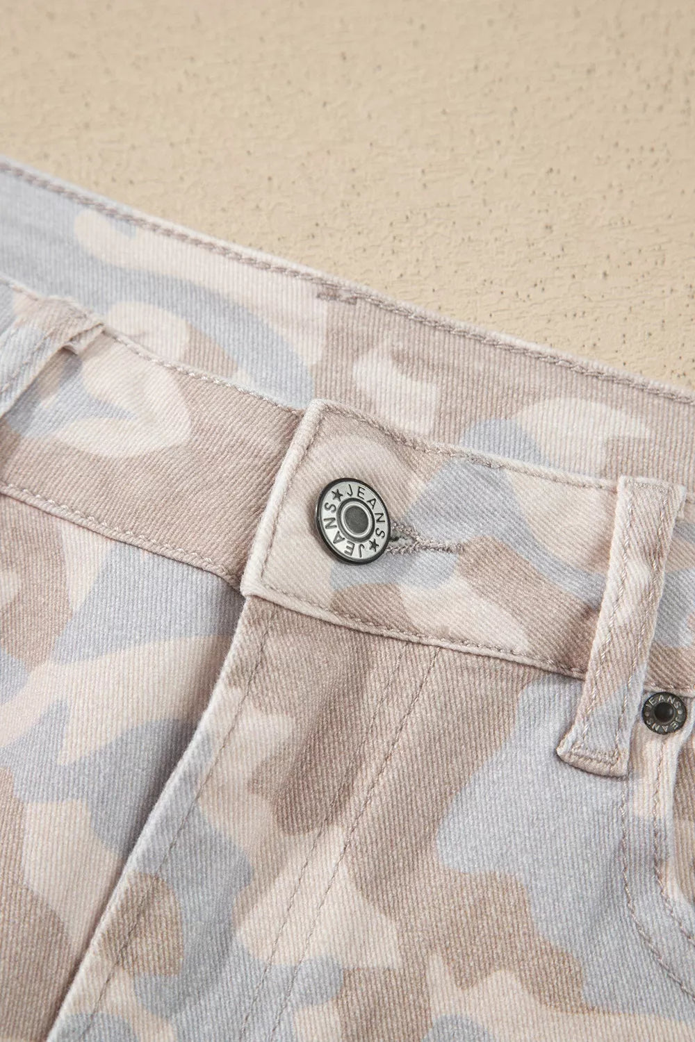 Beige camouflage barrel jeans, waist button detail