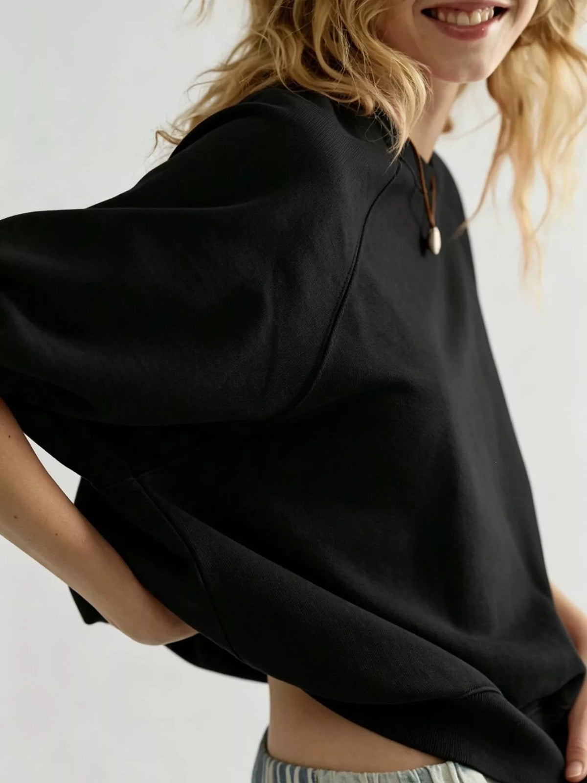 Women's Raglan Short-Sleeve Sweatshirt in black — sleeve detail view