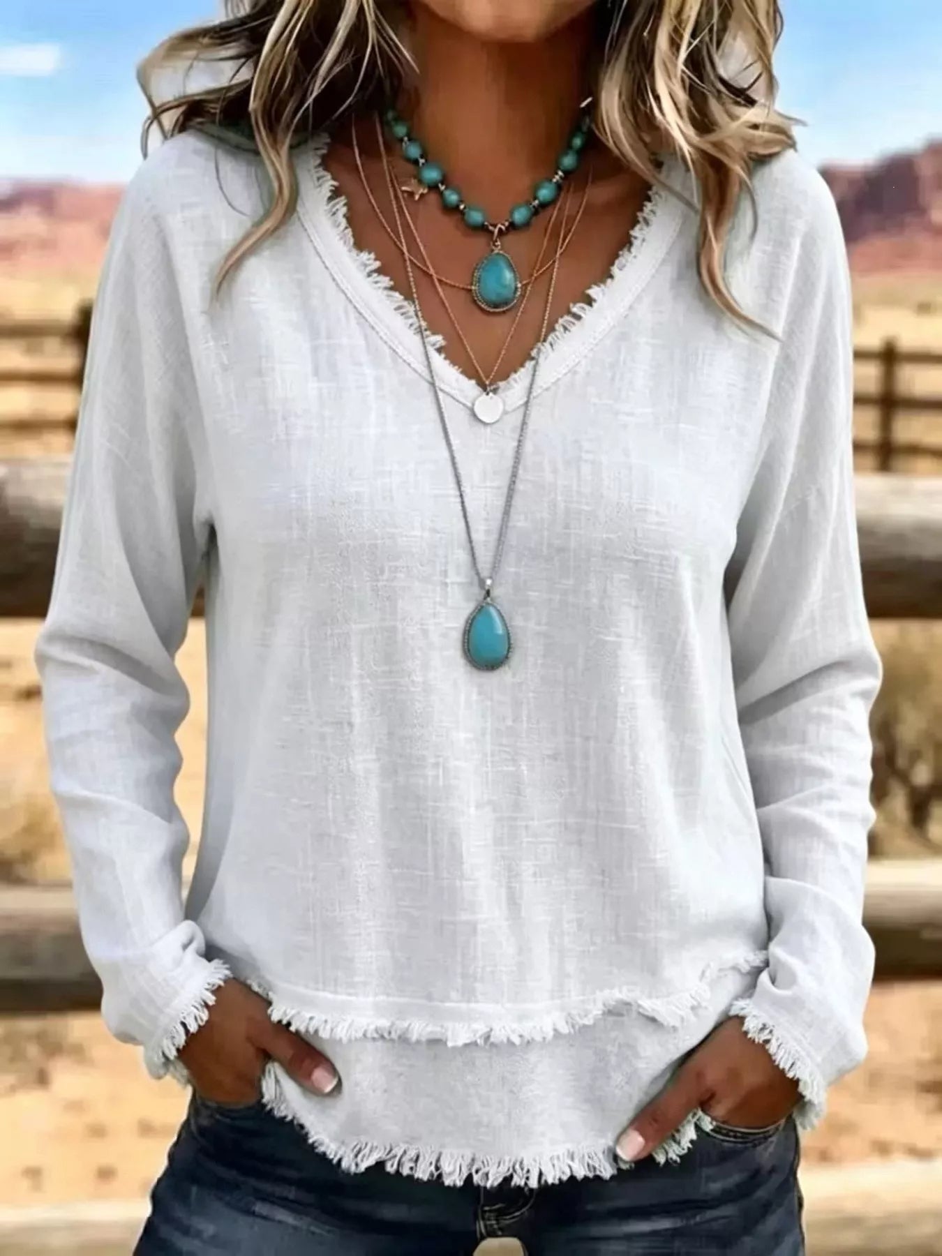 Trendsi V-Neck Long Sleeve Blouse with Frayed Hem Detail -