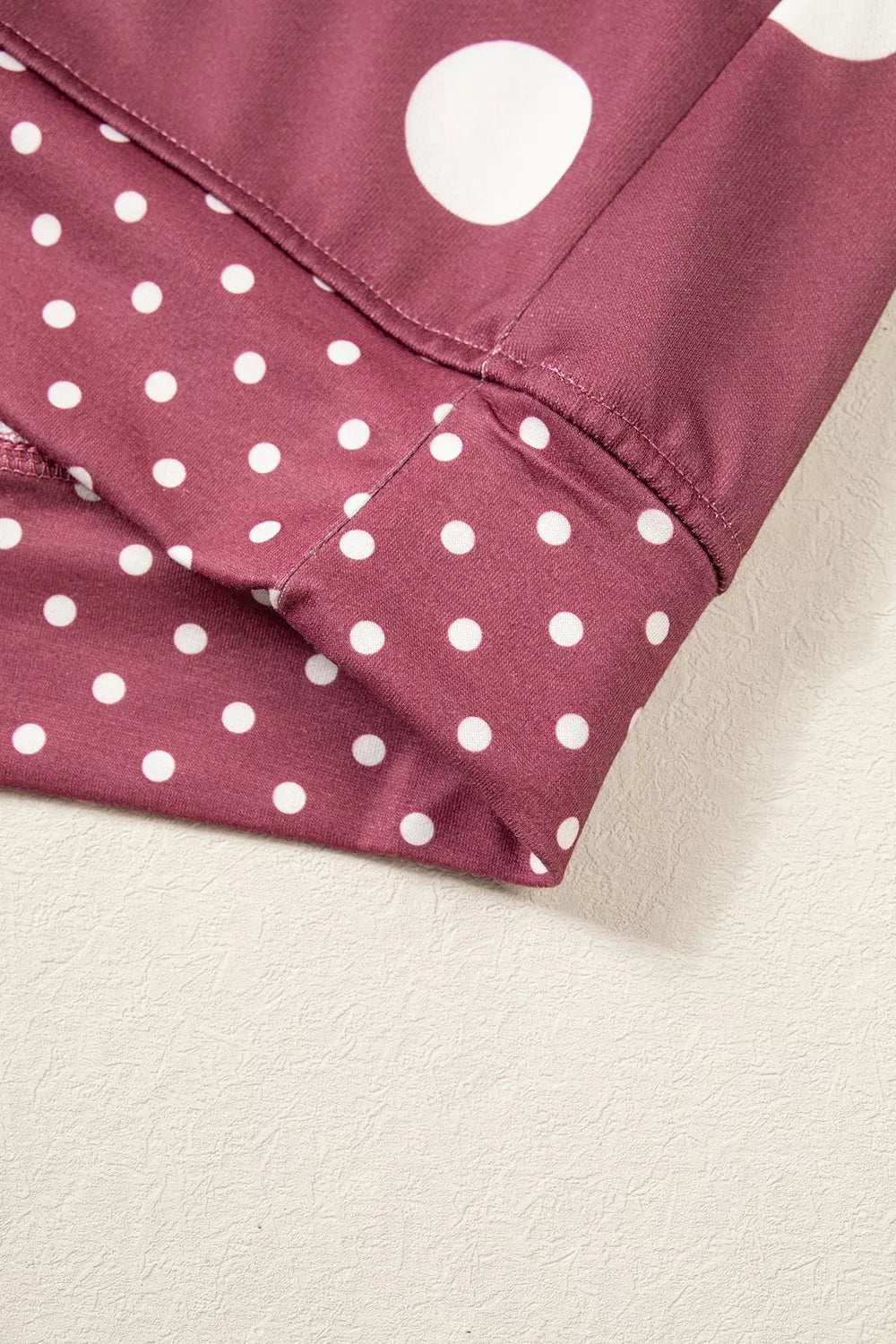 Burgundy polka dot tunic sweatshirt, hem detail