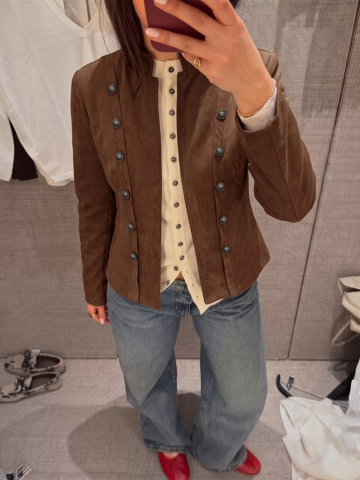 Brown stand collar cropped jacket with decorative buttons, button detail view