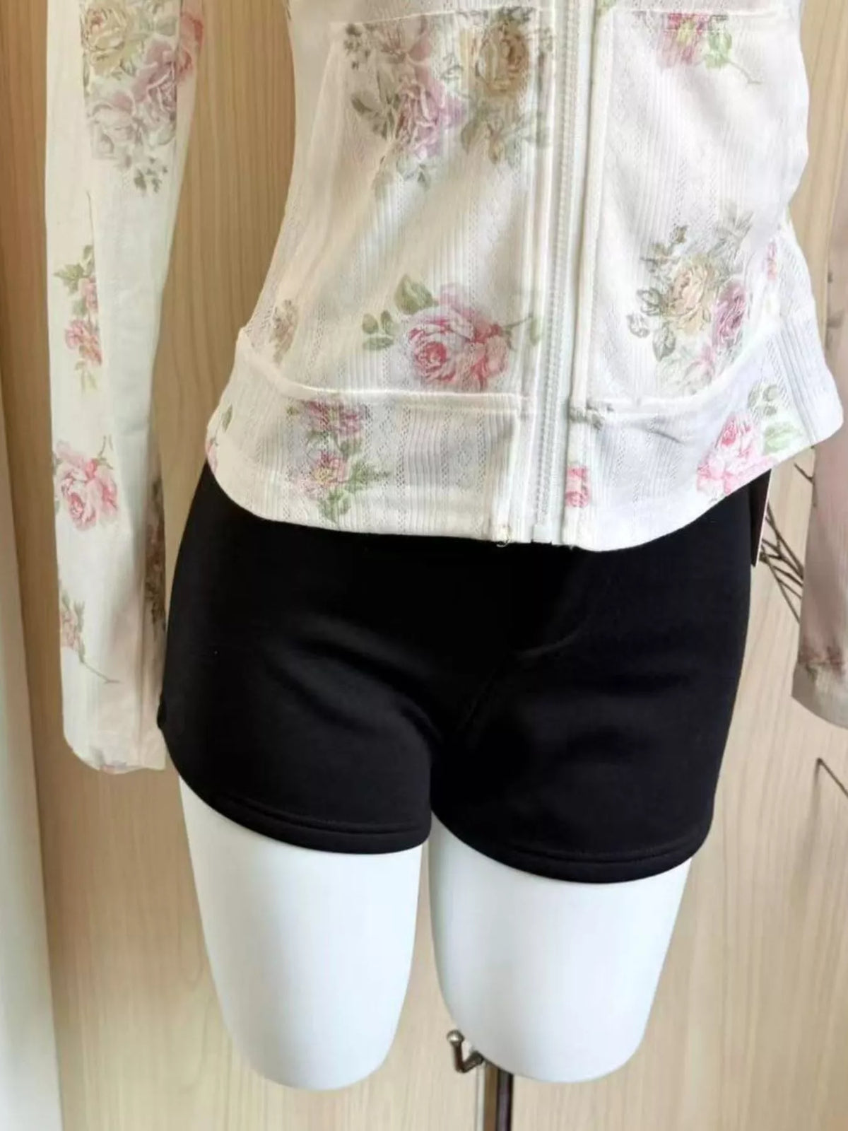 White floral print zip-up knit hoodie, detail view