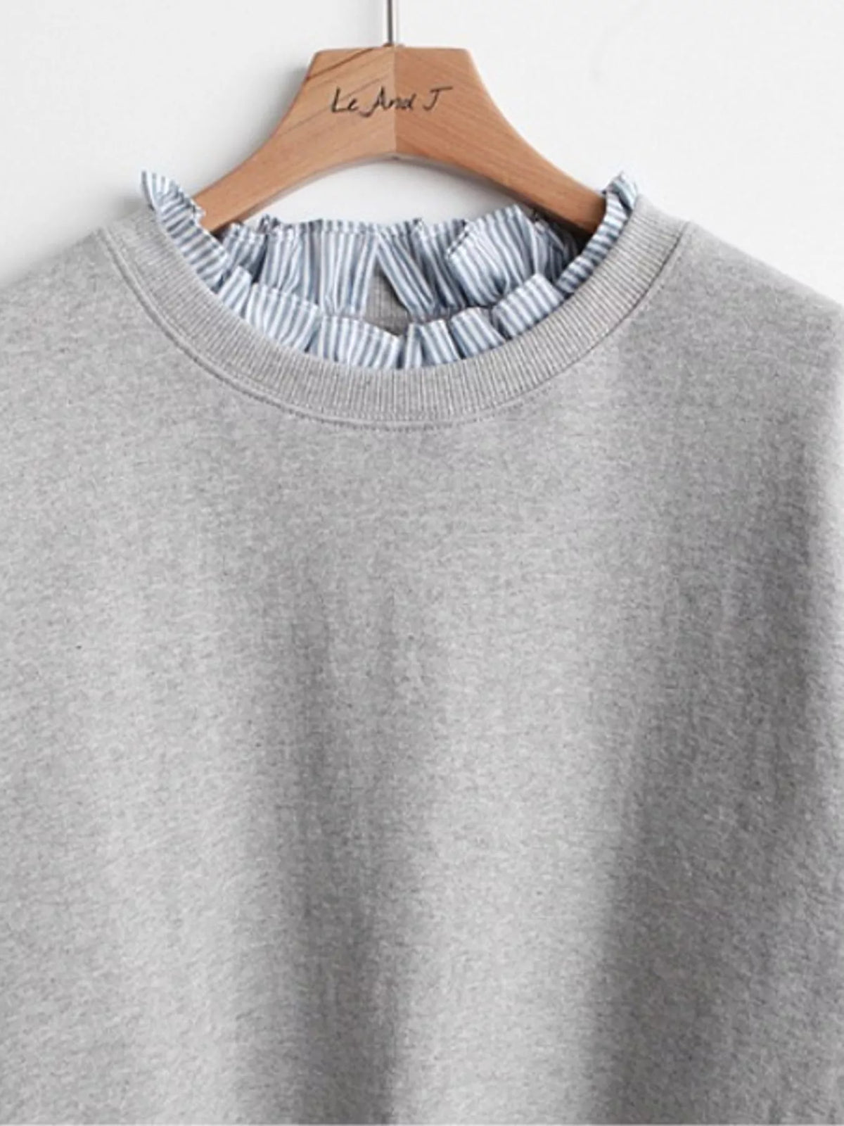 Light Gray crewneck sweatshirt with striped ruffle cuffs, detail view