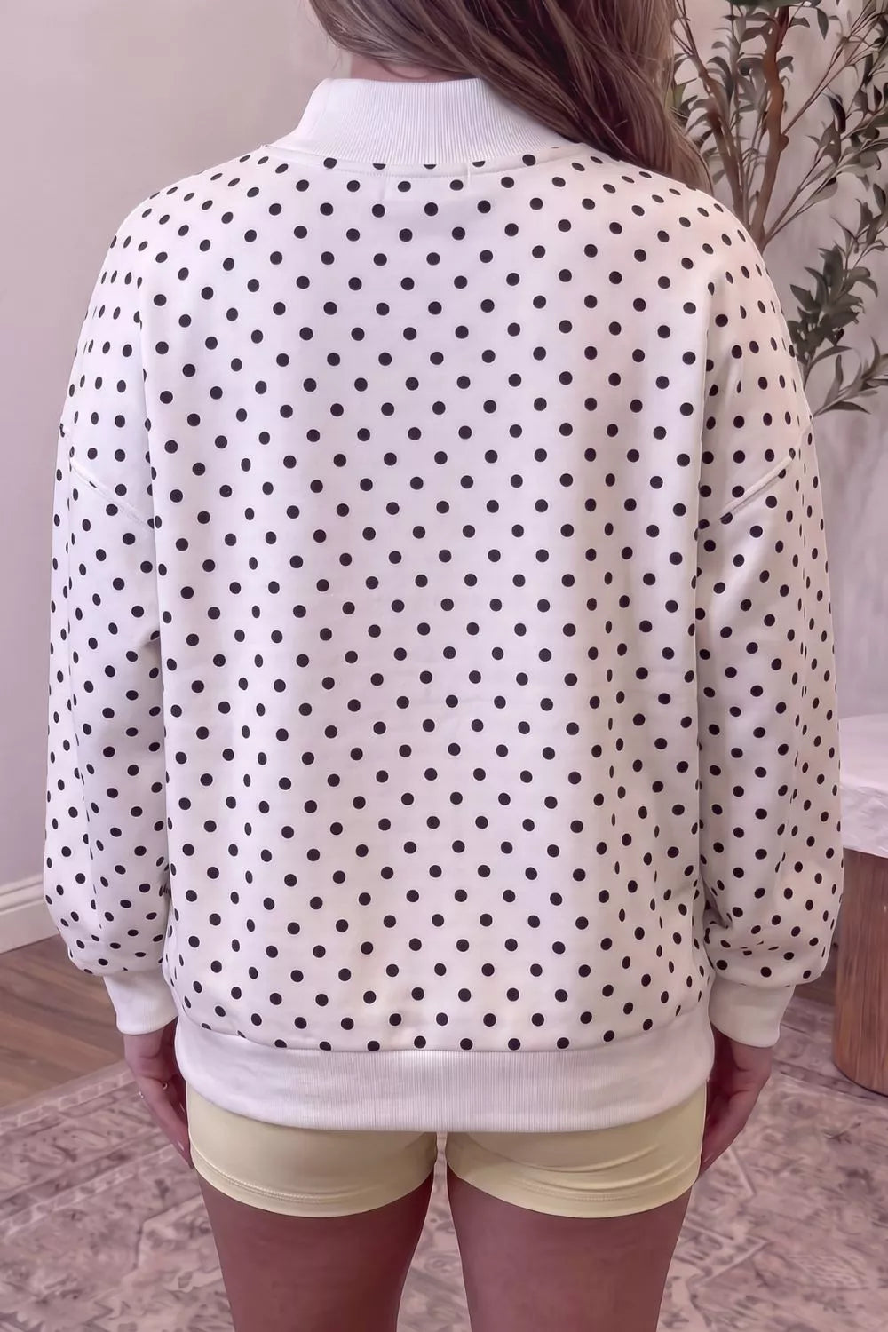 White polka dot mock neck sweatshirt, back view
