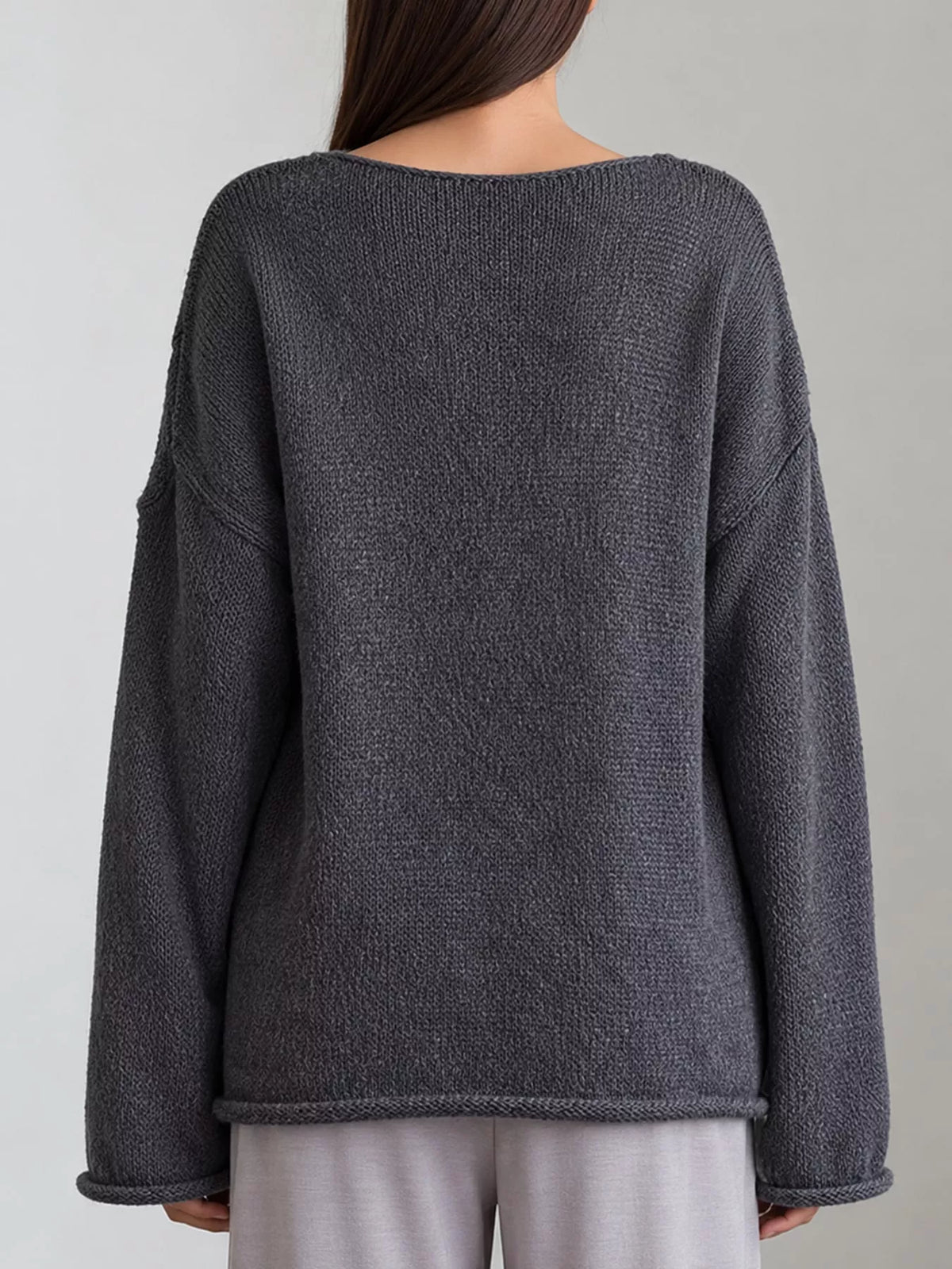 Dark gray sheer openwork knit long sleeve top, back view