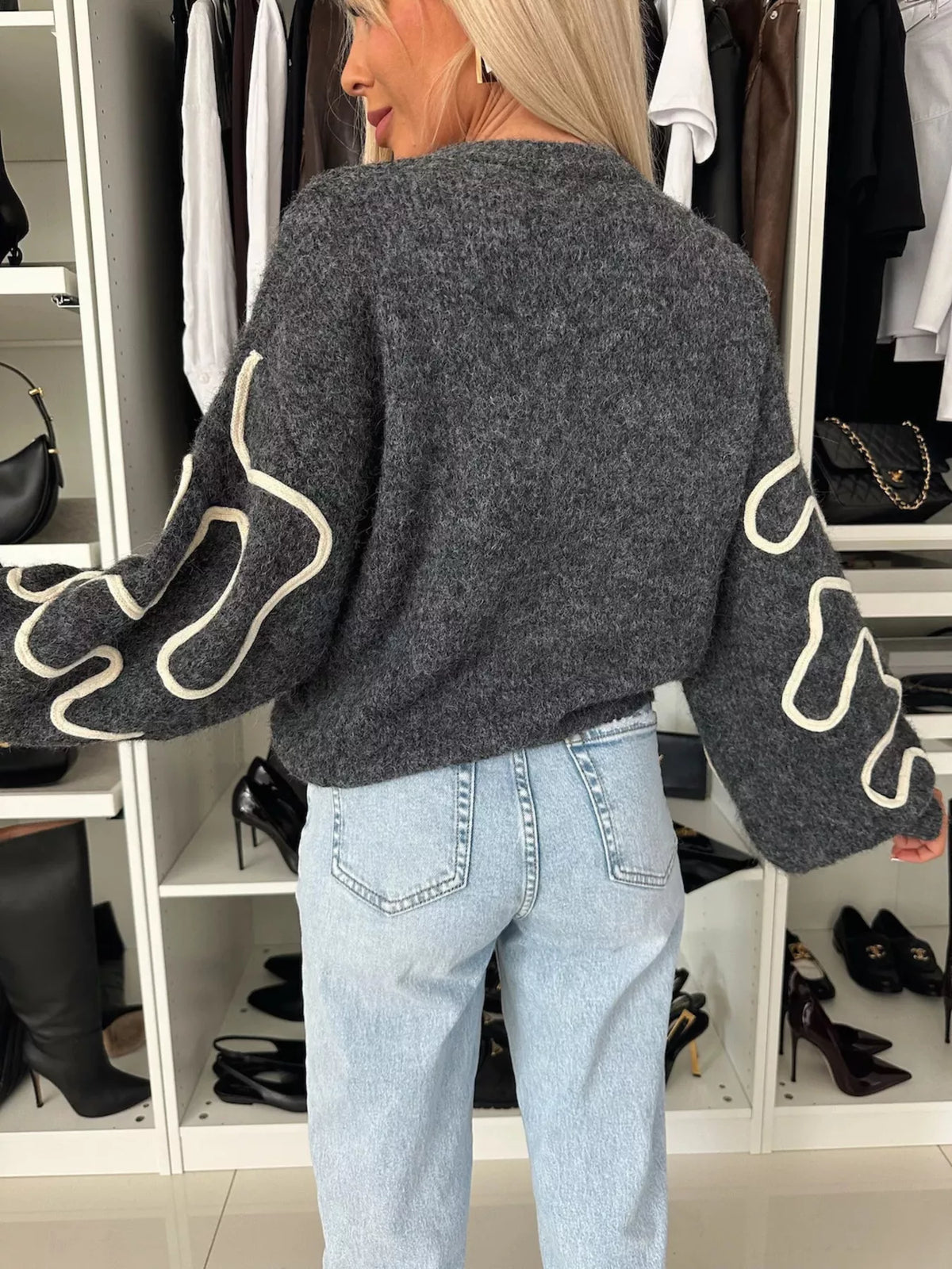 Charcoal abstract pattern oversized crewneck sweater, back view.