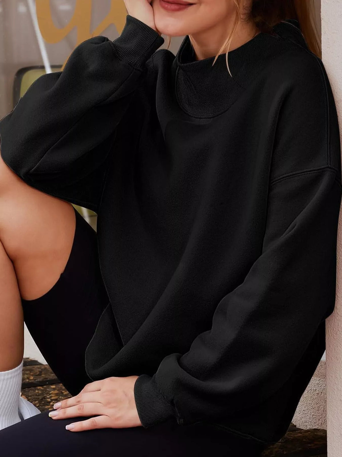 Oversized sweatshirt, black seated view