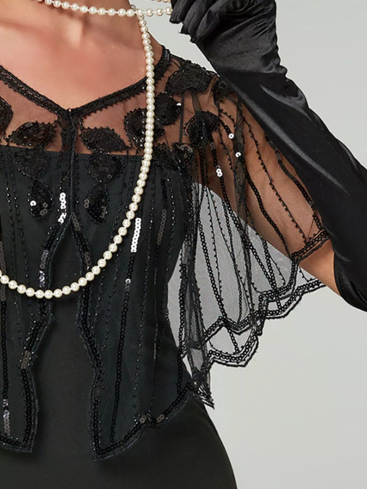 Women's Sequin Sheer Scalloped Capelet in black — neckline detail view
