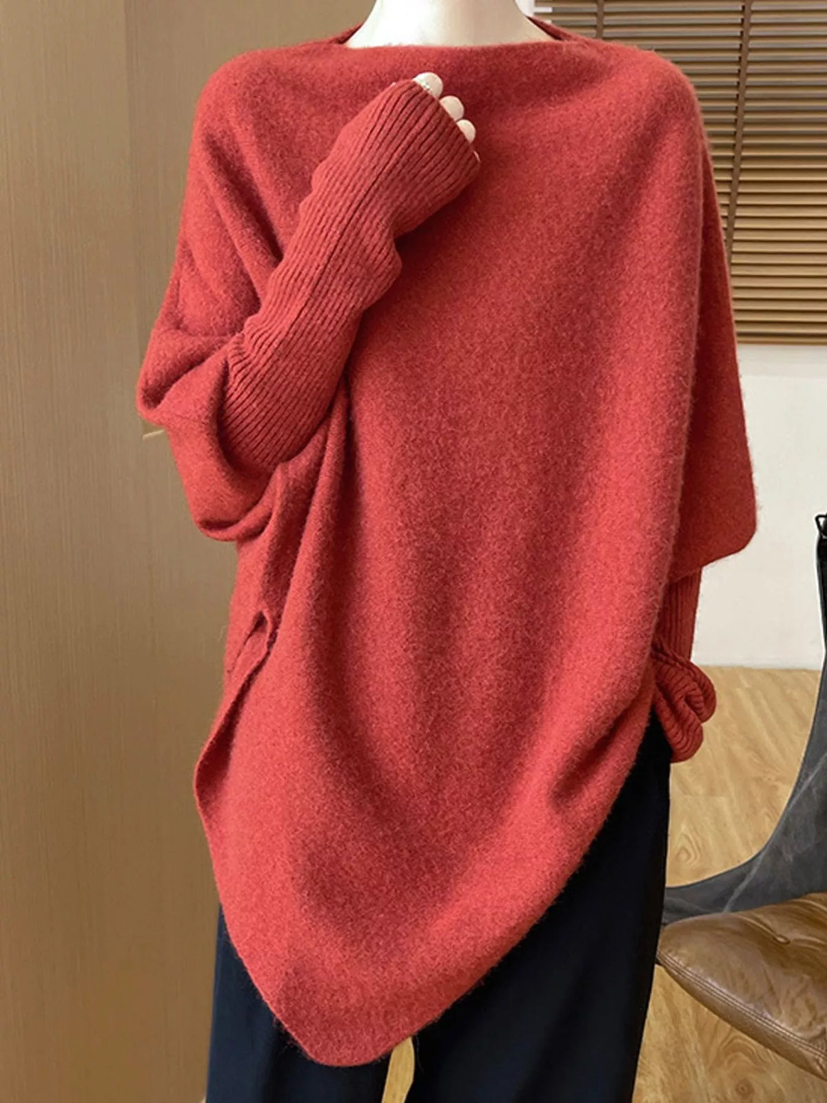 Red asymmetrical lantern sleeve sweater — front view