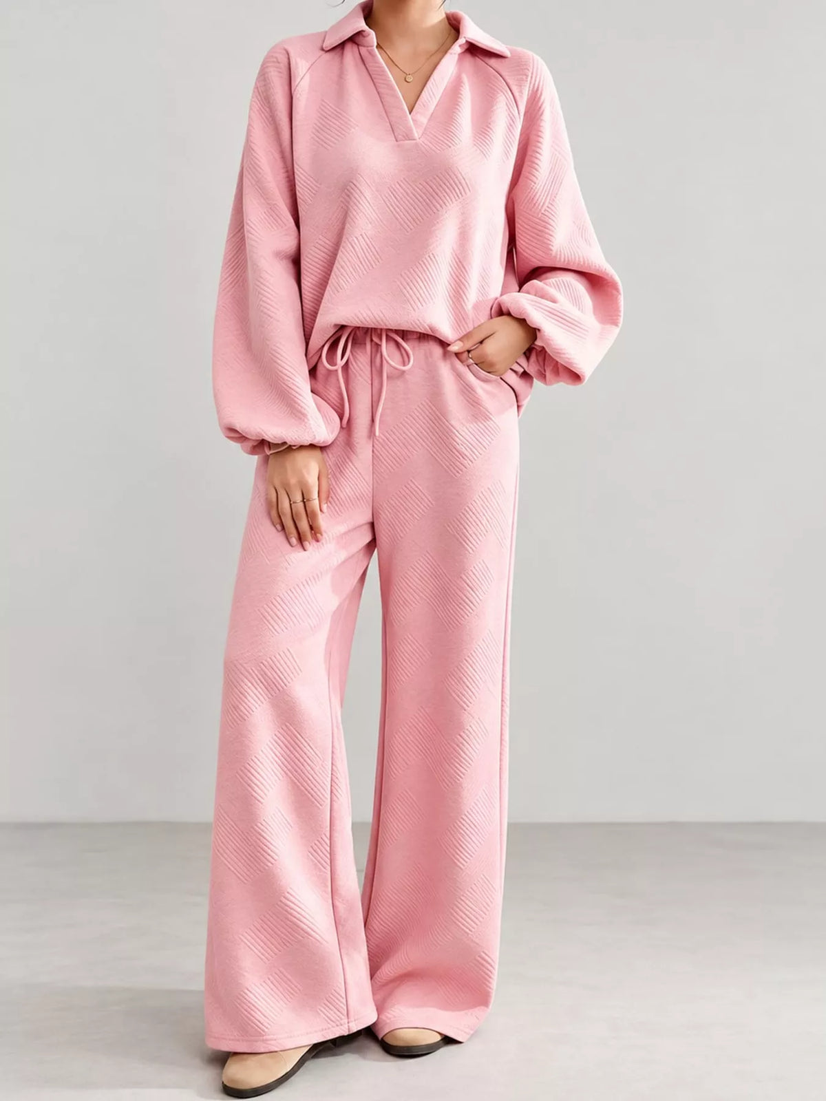 Pink textured polo collar top and wide-leg pants set — front view