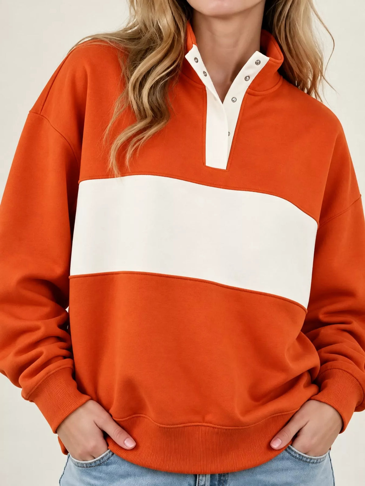 Orange and cream color block snap-button sweatshirt