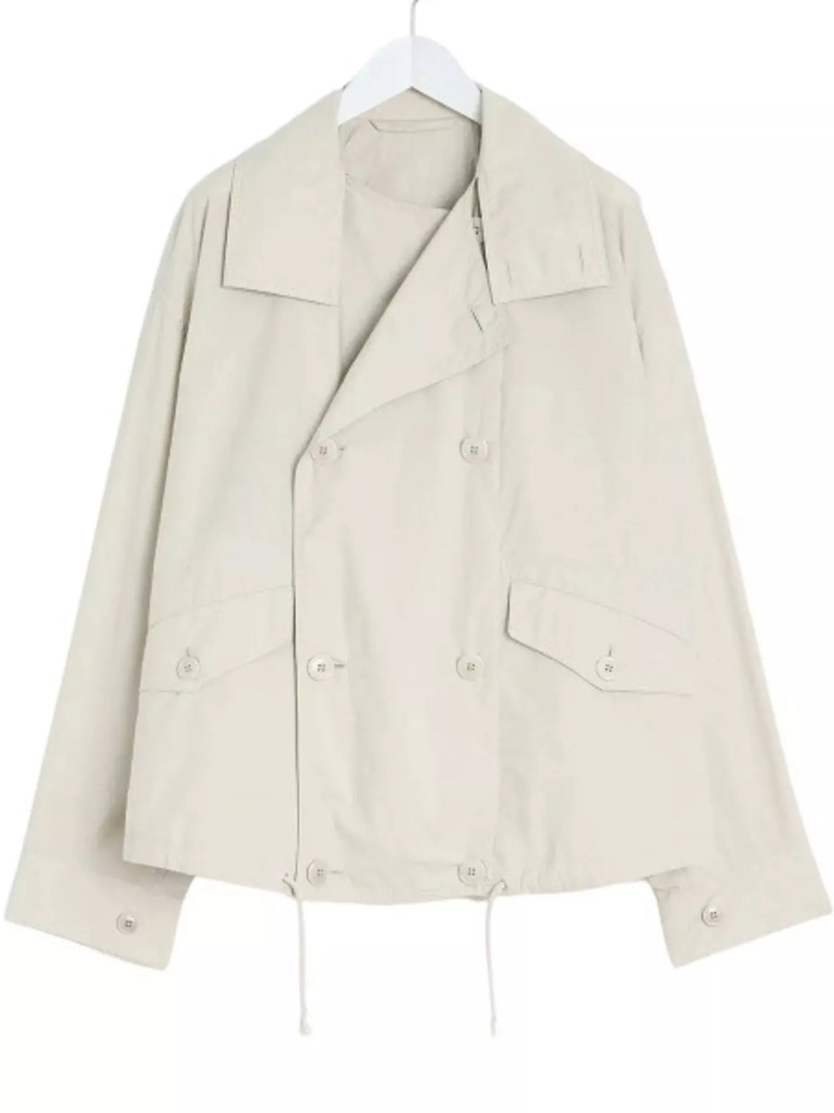Cream double-breasted utility jacket with drawstring hem — front view