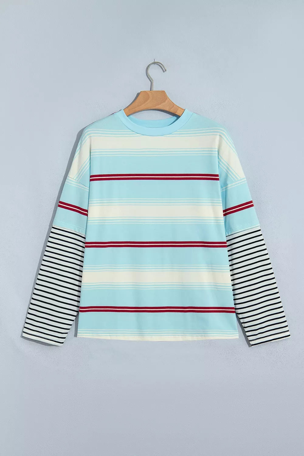 Striped Patchwork Long Sleeve Pullover Top in blue, hanger front view