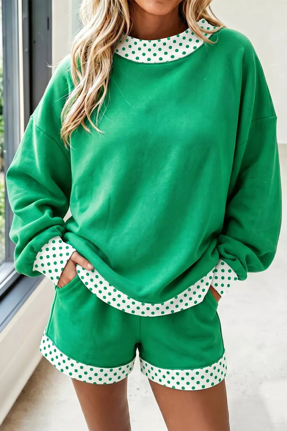 Green sweatshirt and shorts set with polka-dot trim, front view