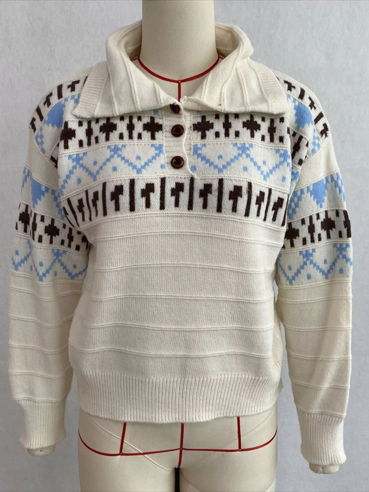 Cream fair isle polo-collar sweater, front on dress form.