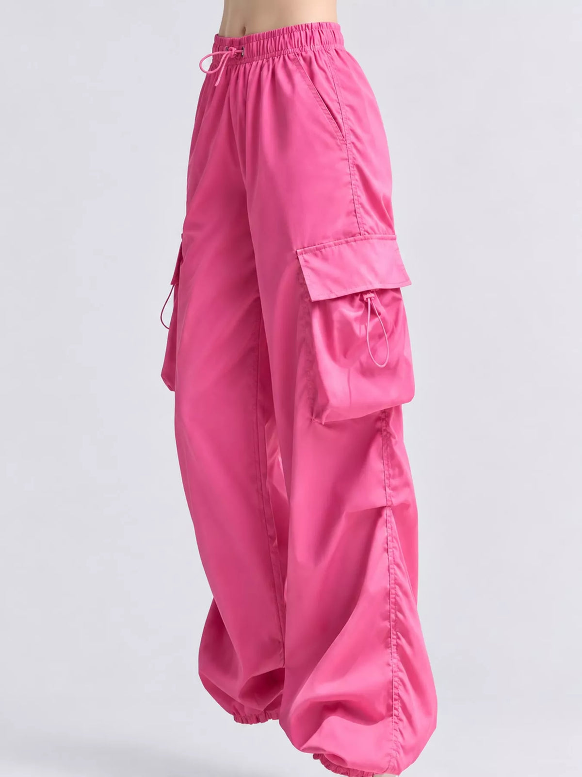 Pink drawstring cargo pants, side view