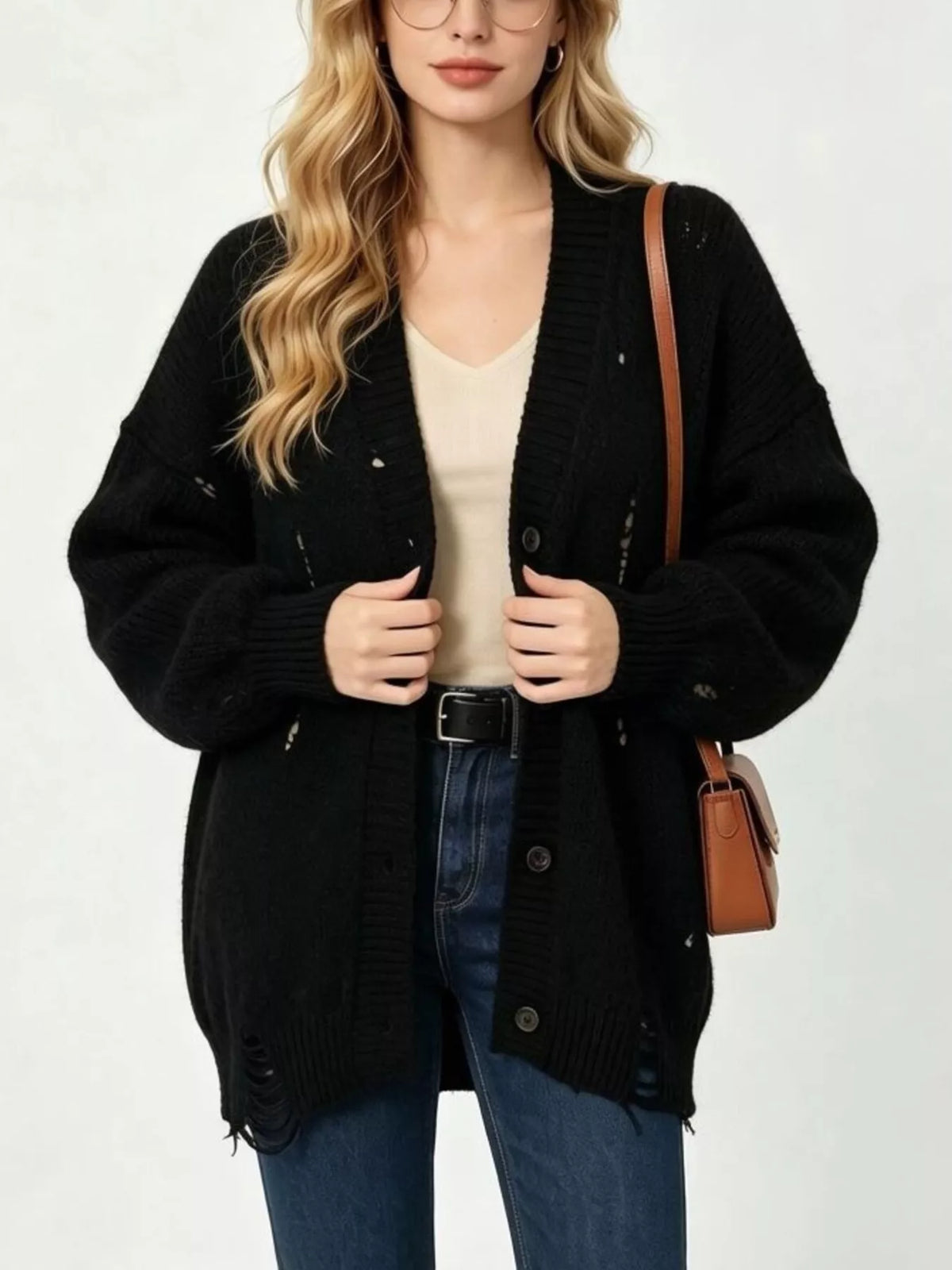 Black distressed cardigan, sleeve and hem view