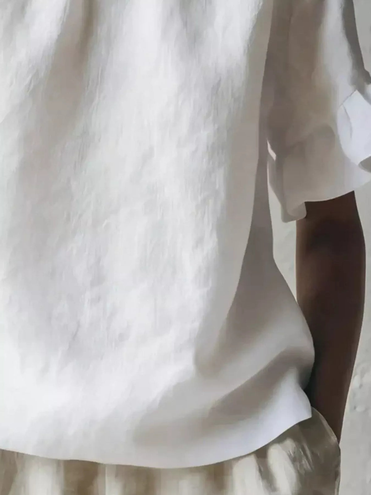 White Ruffle-Neck Short Sleeve Blouse, hem detail