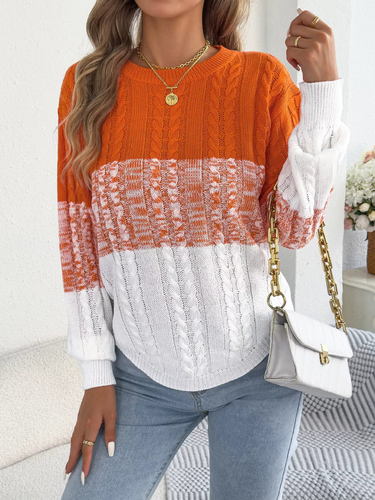 Orange color block cable knit sweater
