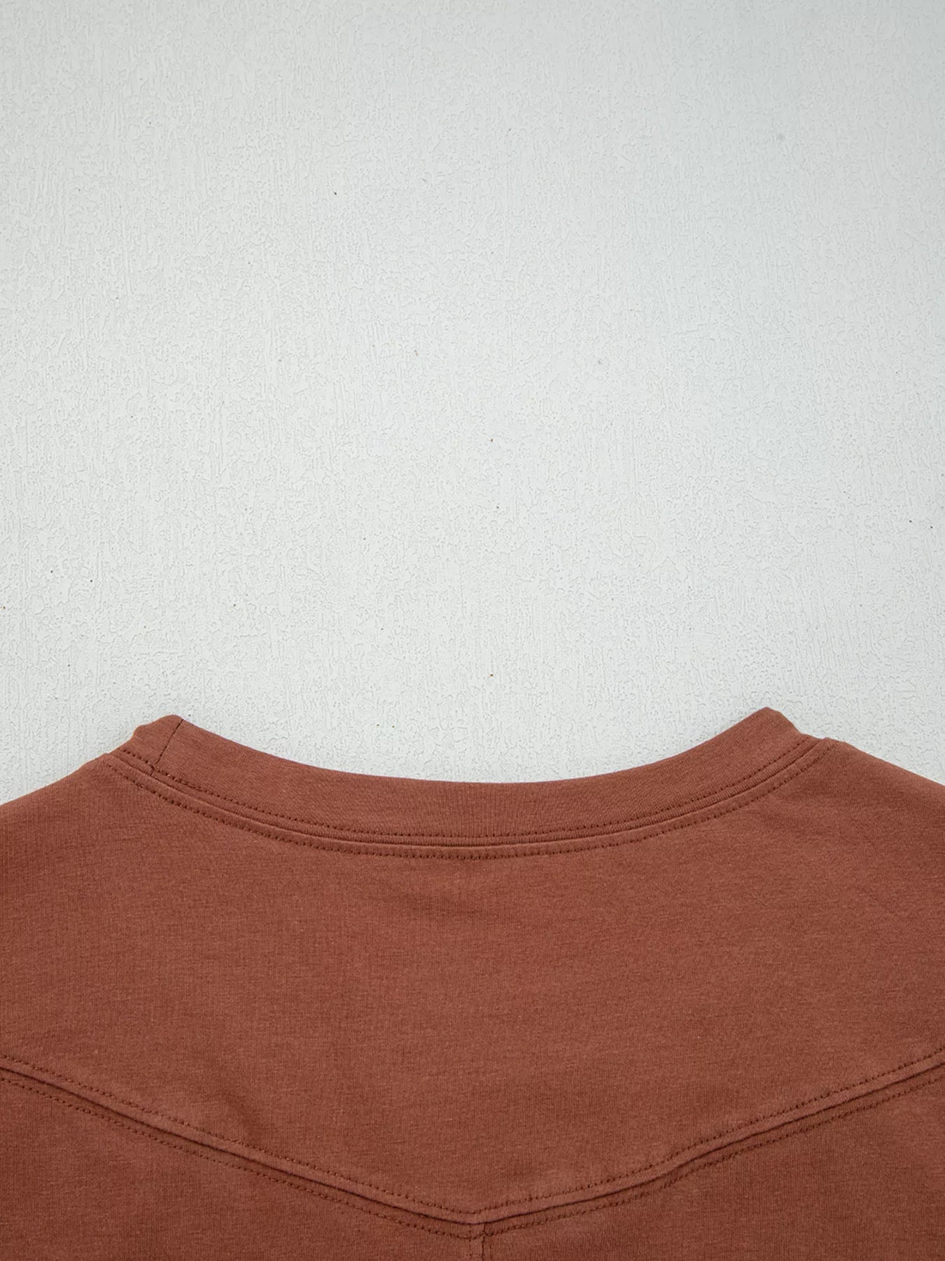 Trendsi Raw Seam Detail Solid Color Long Sleeve Top -