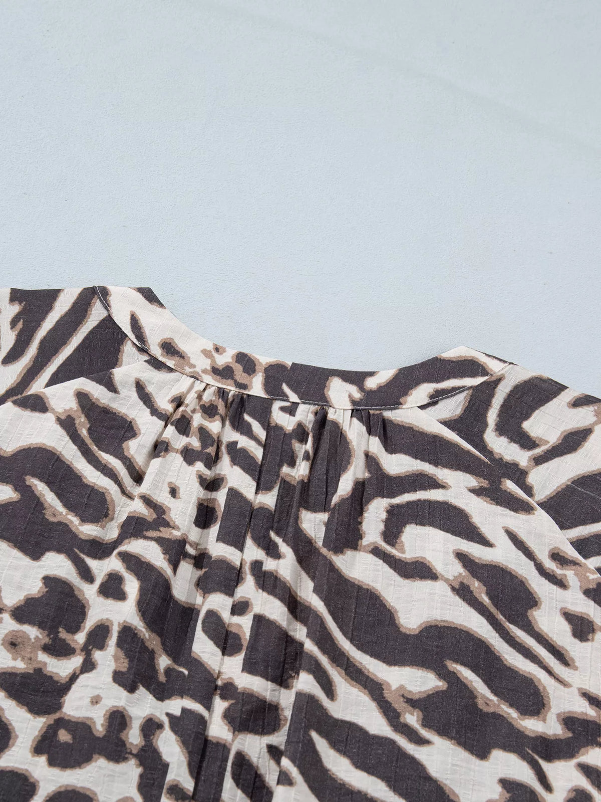 Leopard Print V Neck Button Down Balloon Sleeve Shirt in dark brown, construction detail