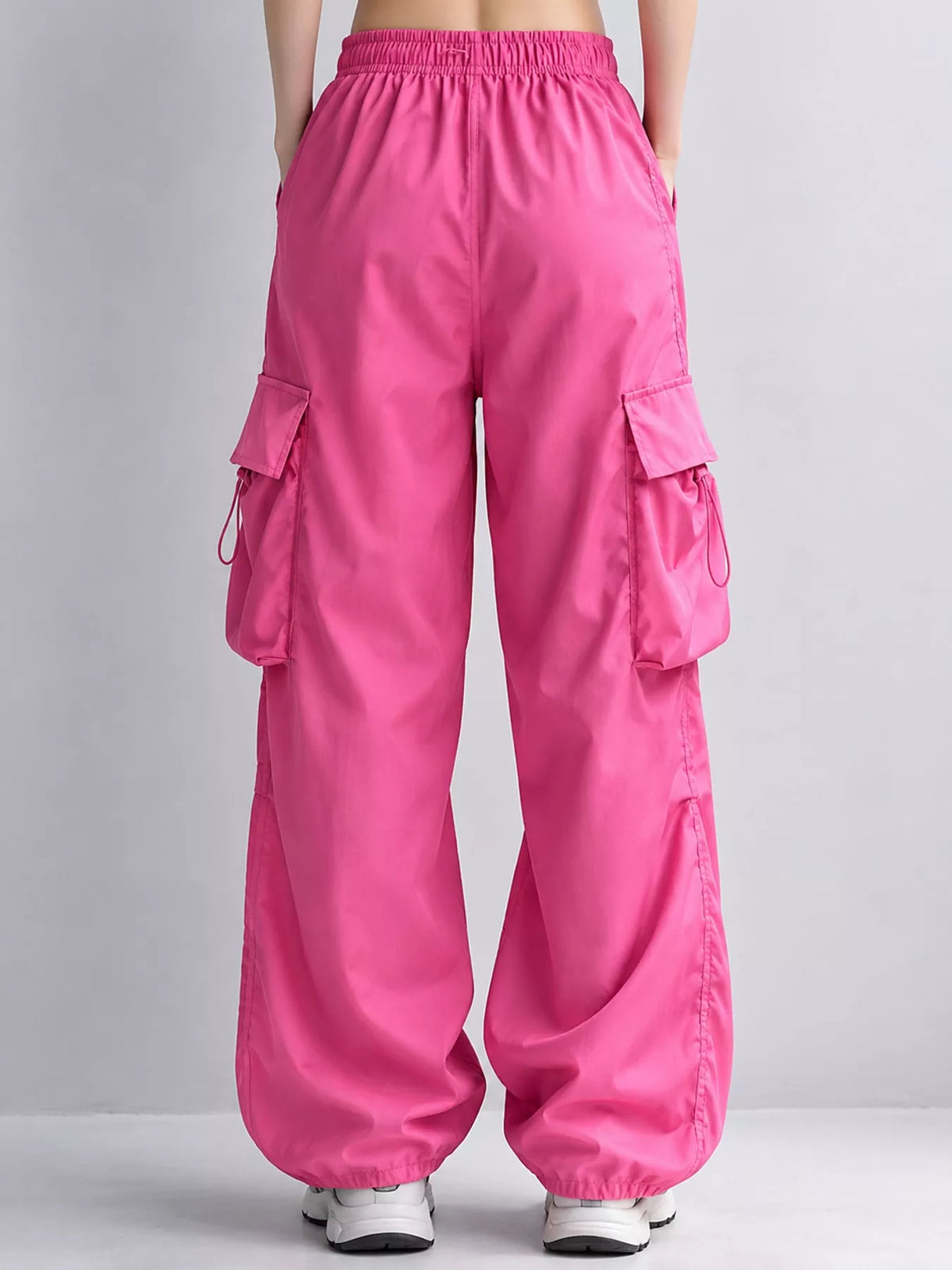 Pink drawstring cargo pants, back view