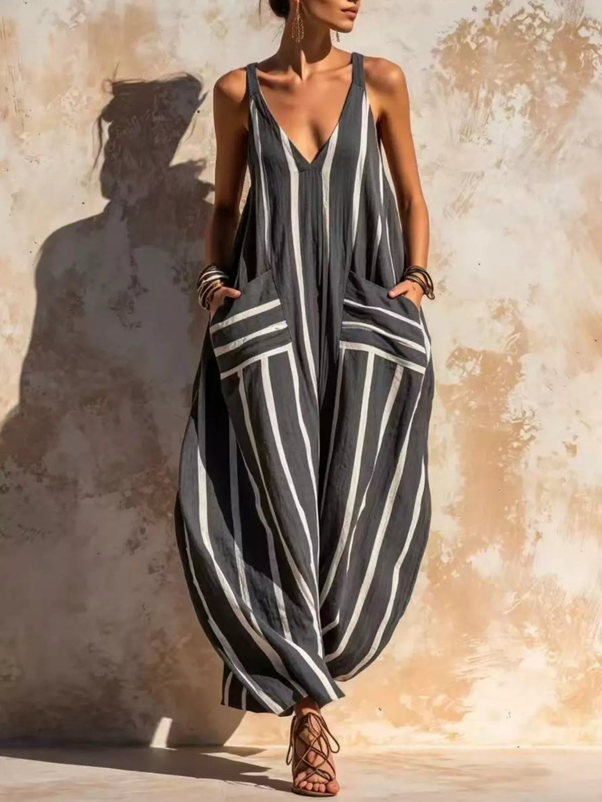 Black and white striped sleeveless jumpsuit, full front view