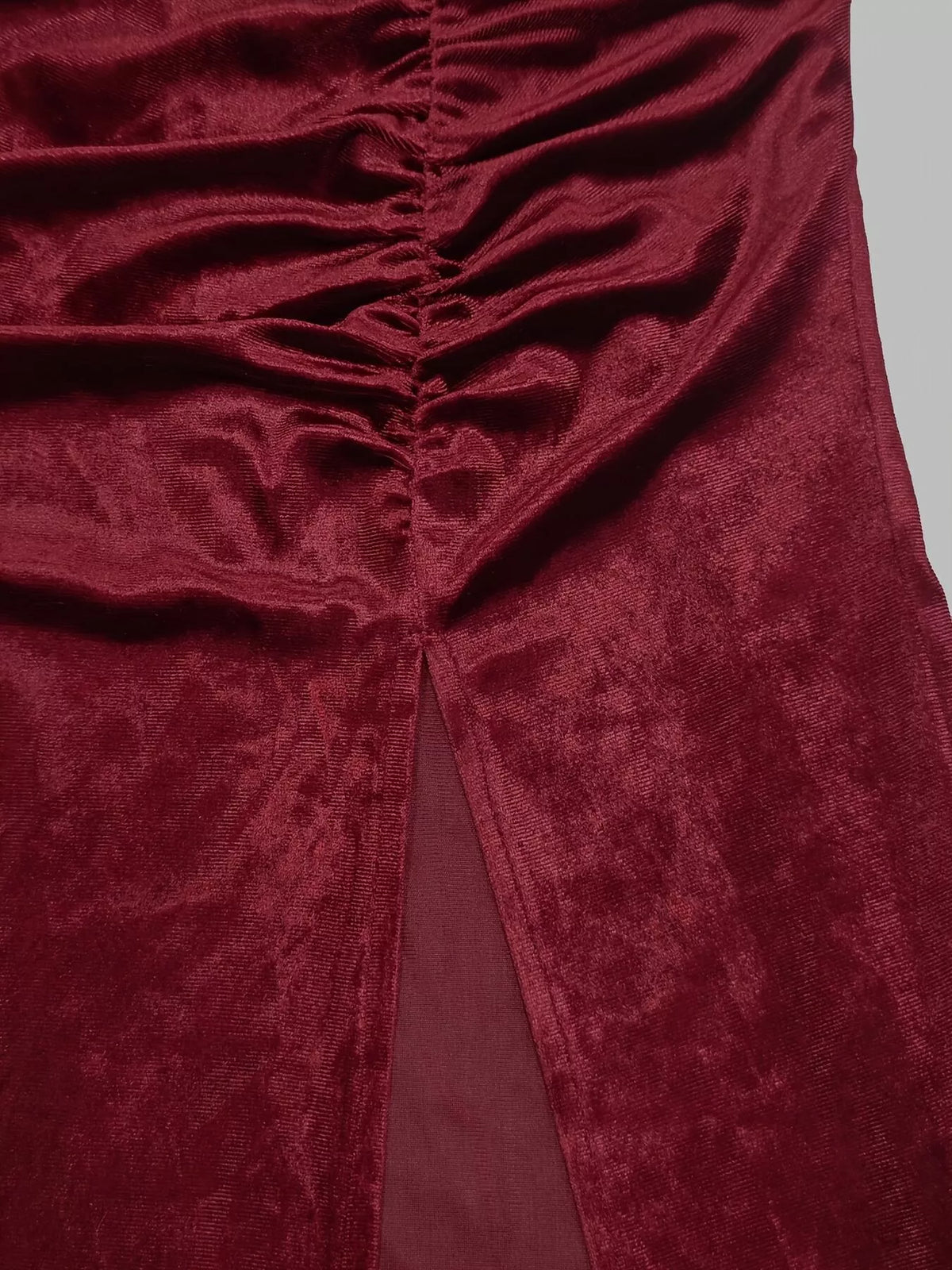 Burgundy velvet mock neck maxi dress, slit and ruching detail