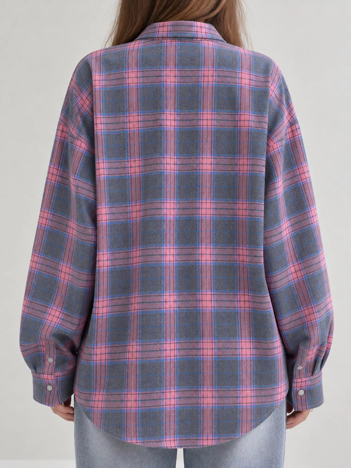 Pink and gray plaid button-up shirt with chest pockets, back view