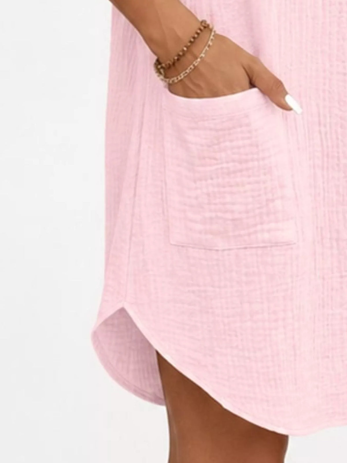 Pink textured button-front shirt dress with pockets, pocket and curved hem detail