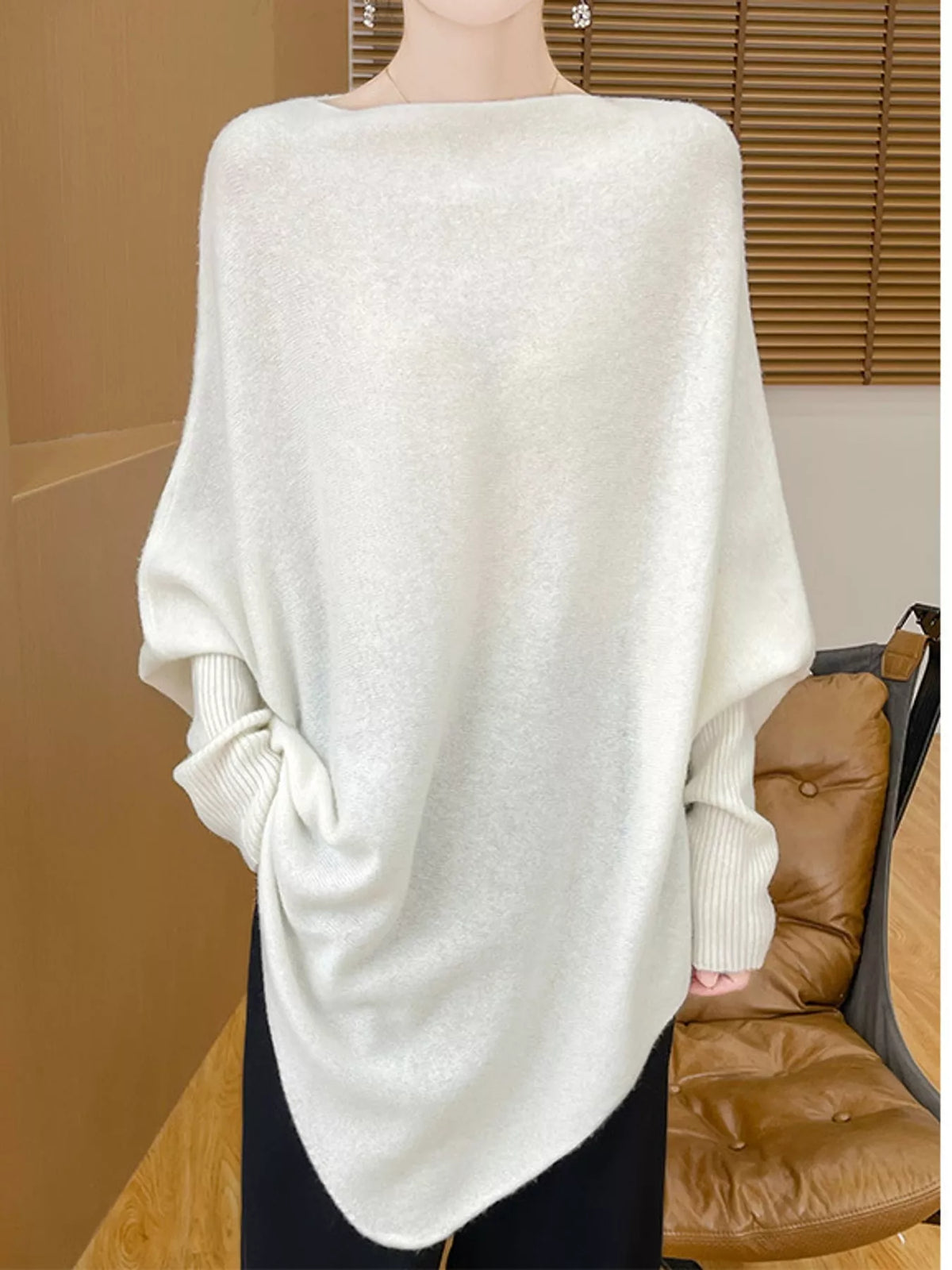 White asymmetrical lantern sleeve sweater — front view