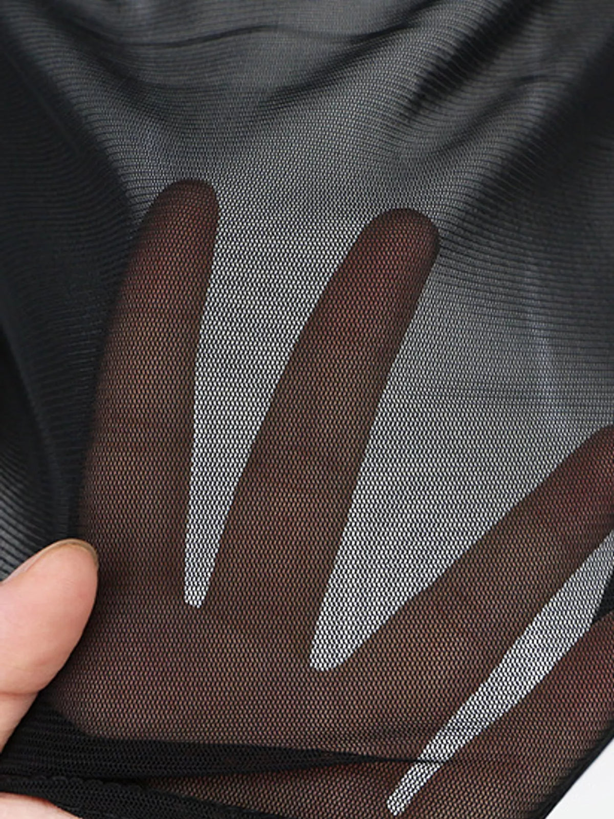 Black sheer mesh long sleeve top, sheer fabric close-up