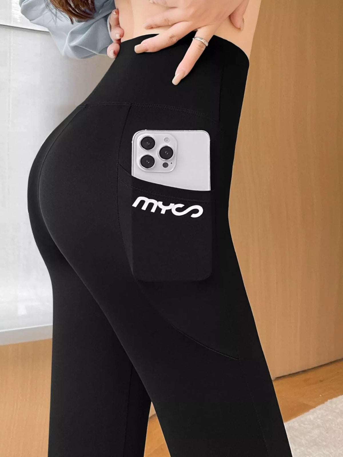 Women's High-Waisted Active Leggings with Side Pockets in black — pocket detail view