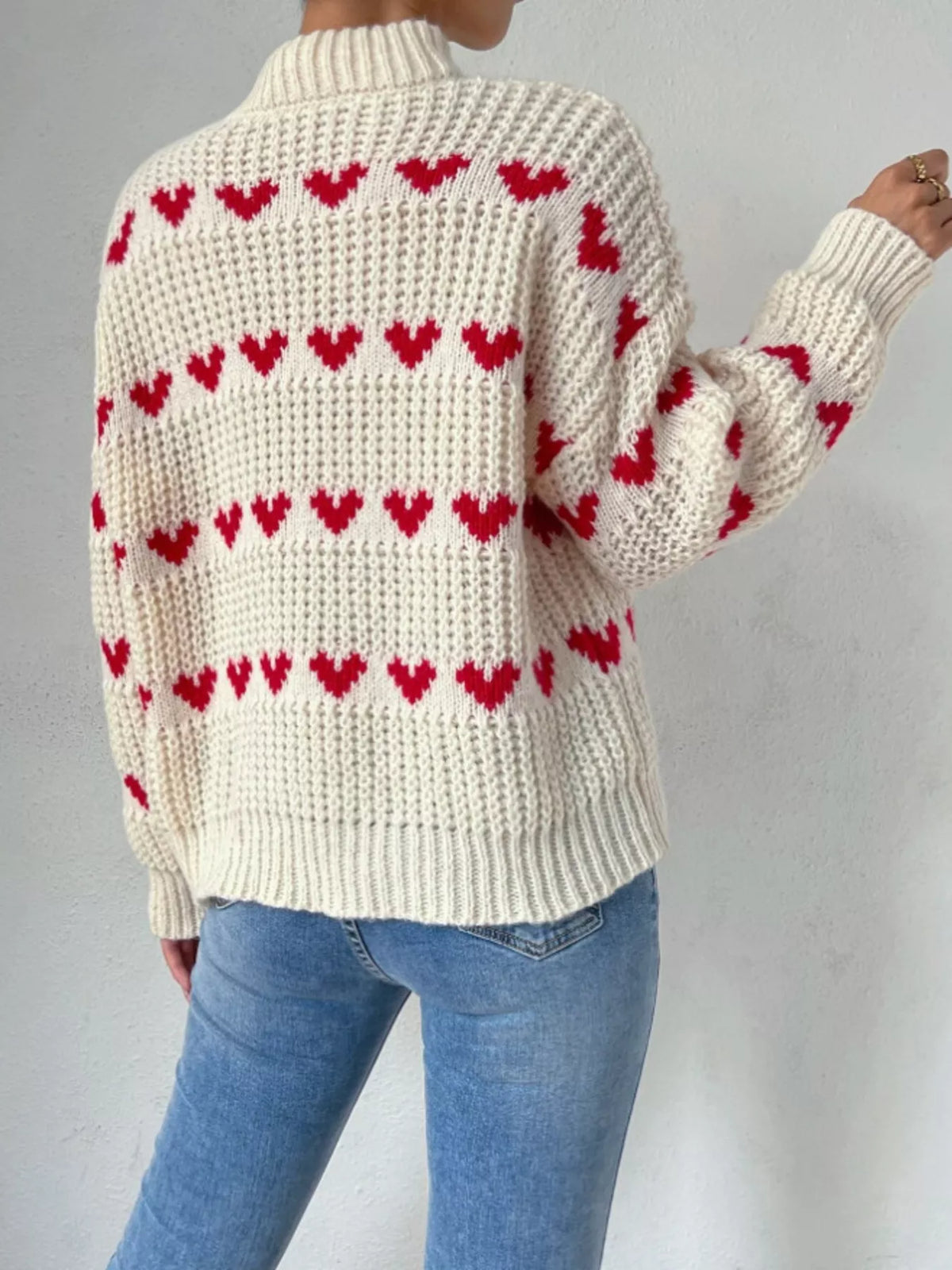 Cream and red heart-pattern chunky-knit sweater, back view