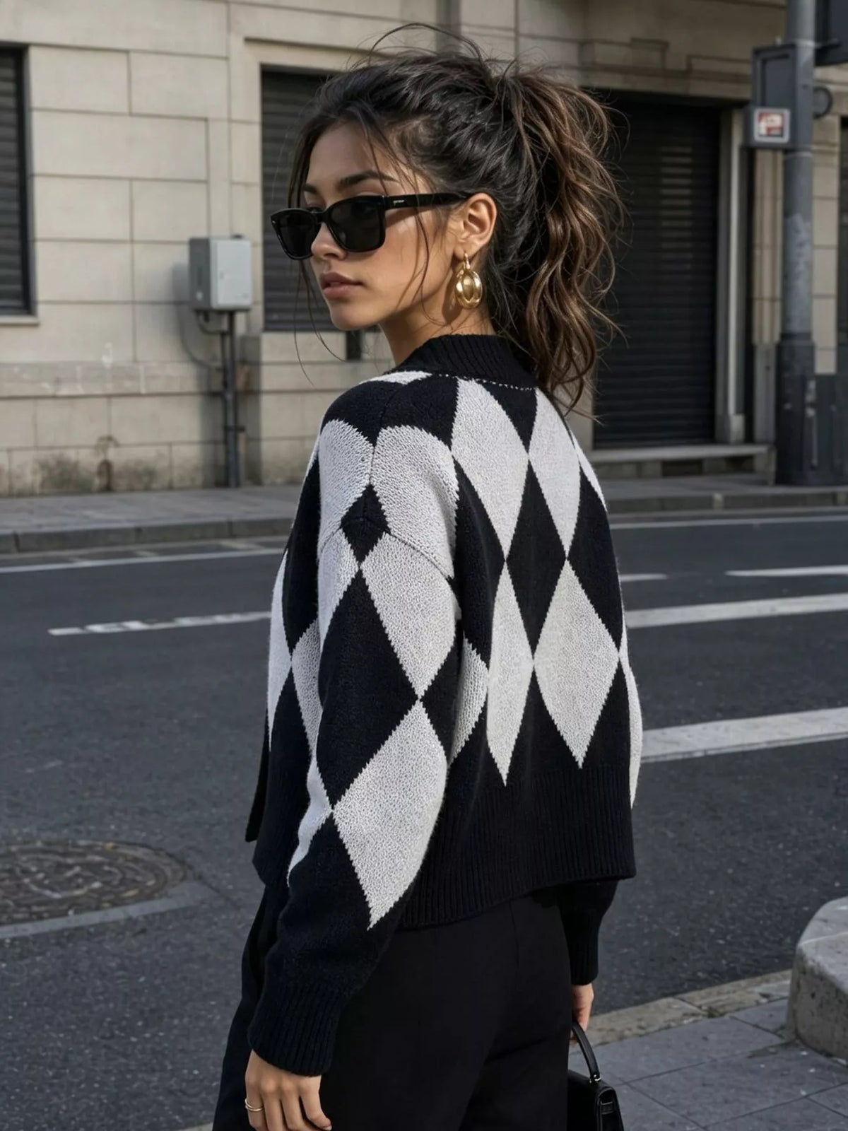 Black and white argyle v-neck button-front cardigan, back view.