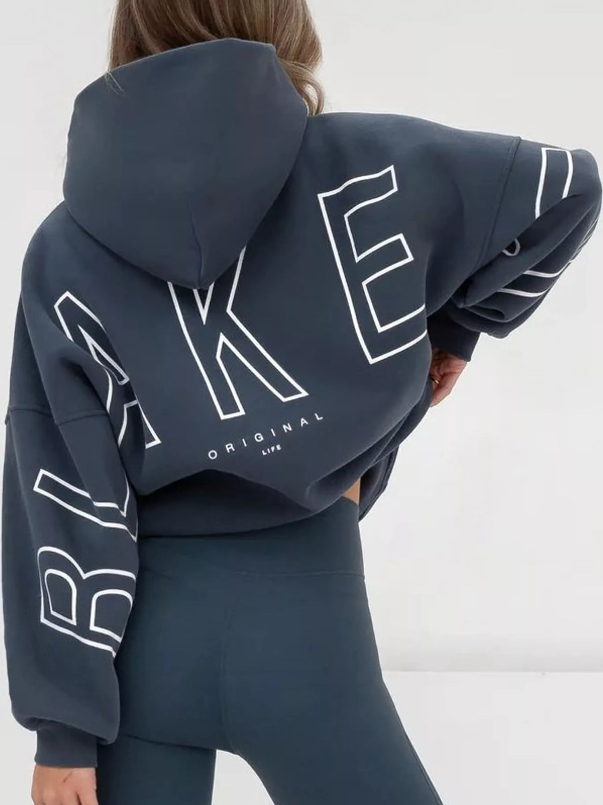 Slate blue letter-print pullover hoodie with kangaroo pocket, back lettering view