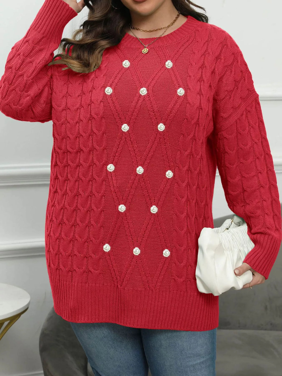 Red plus-size cable-knit sweater with pearl-like front accents, front view