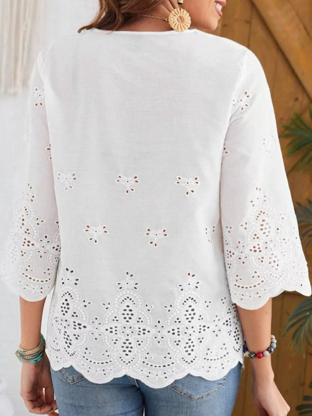 White eyelet embroidered v-neck blouse, back view