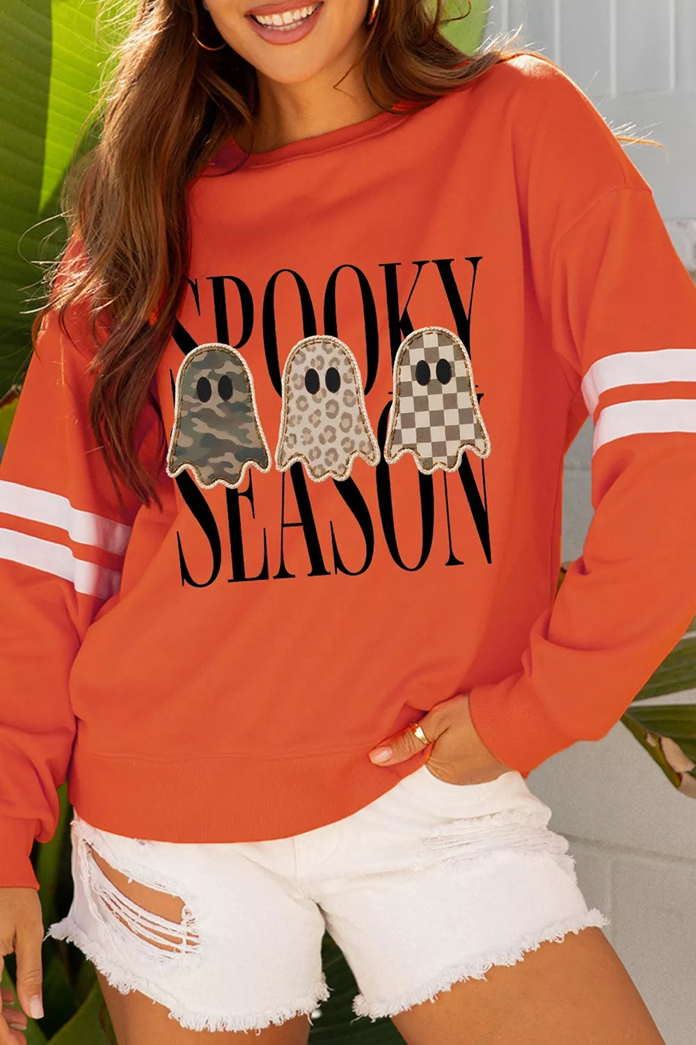 Spooky Season Ghost Striped Sleeve Sweatshirt in orange, front view