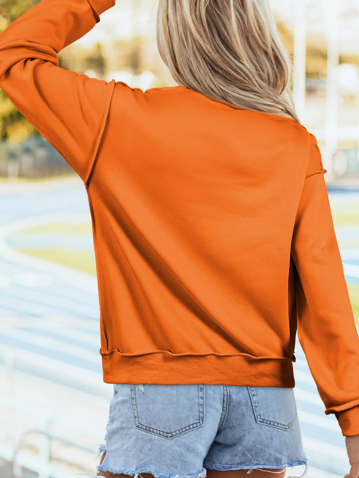 Women's Polka Dot Pumpkin Face Halloween Graphic Pullover Sweatshirt in Orange, alternate view