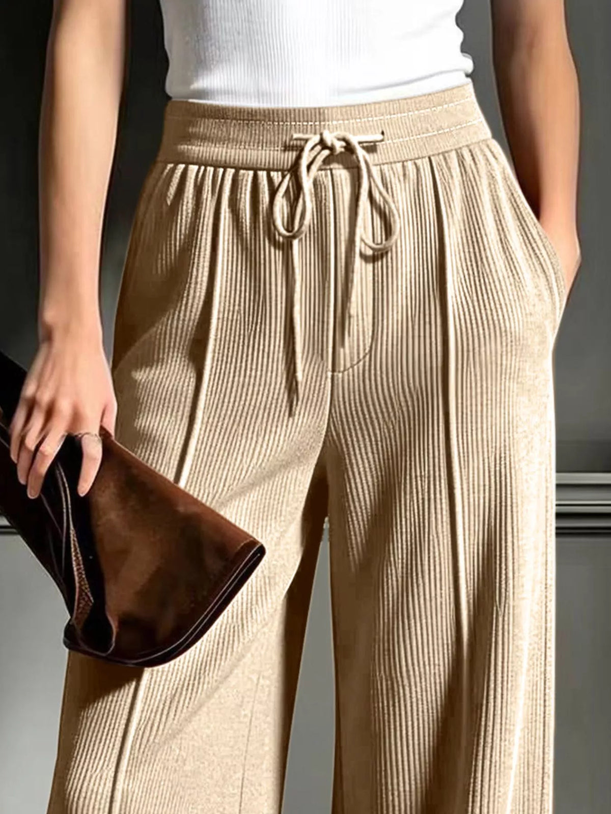 Beige wide-leg ribbed corduroy pants, drawstring waistband and side pockets