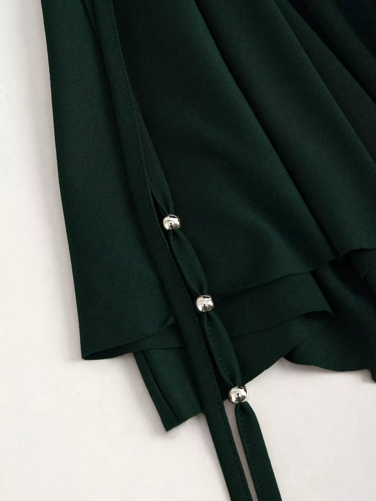 Ruched Asymmetrical Drawstring Mini Skirt, detail view in dark green