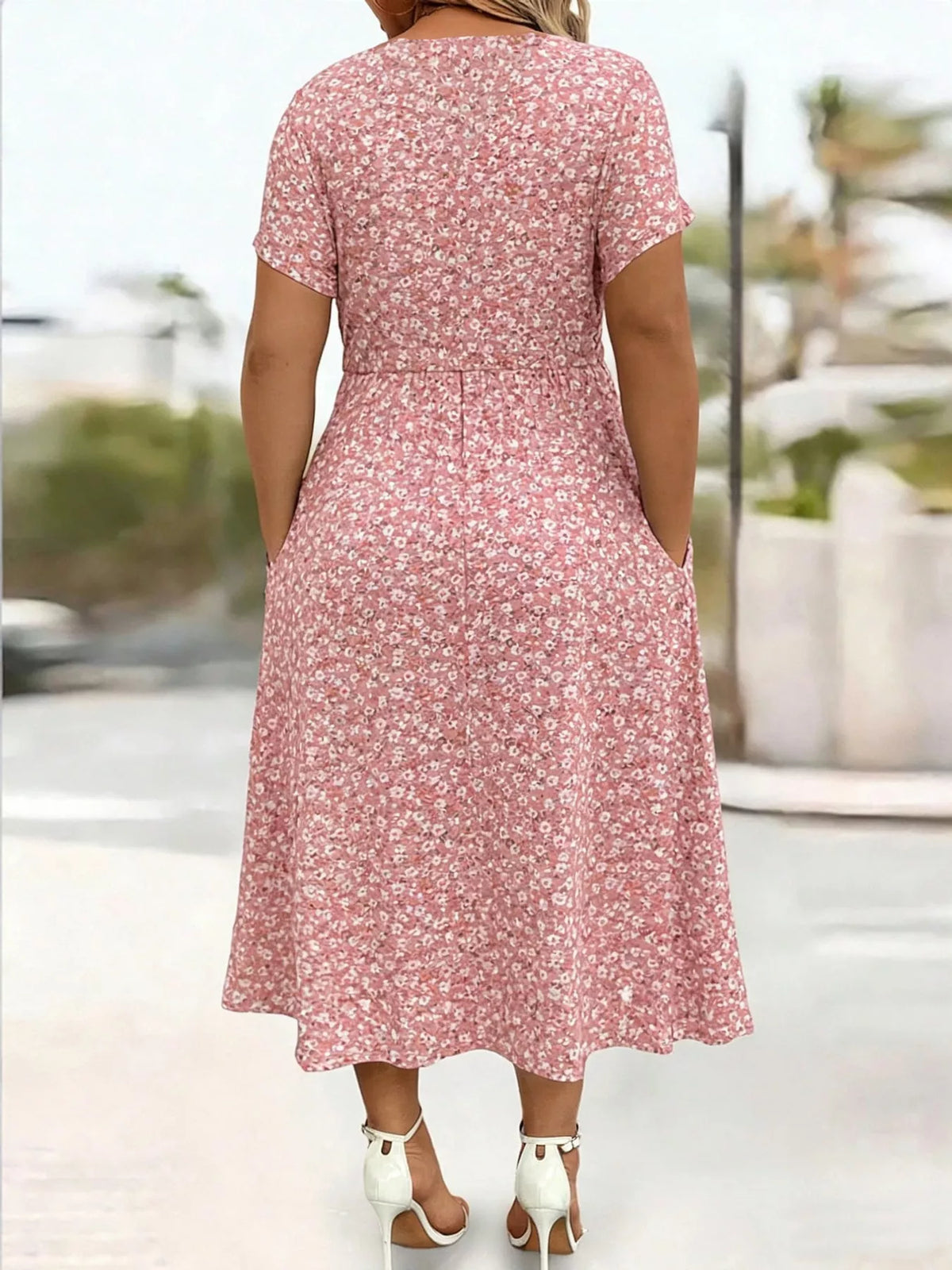 Pink floral short sleeve midi dress with pockets, back view