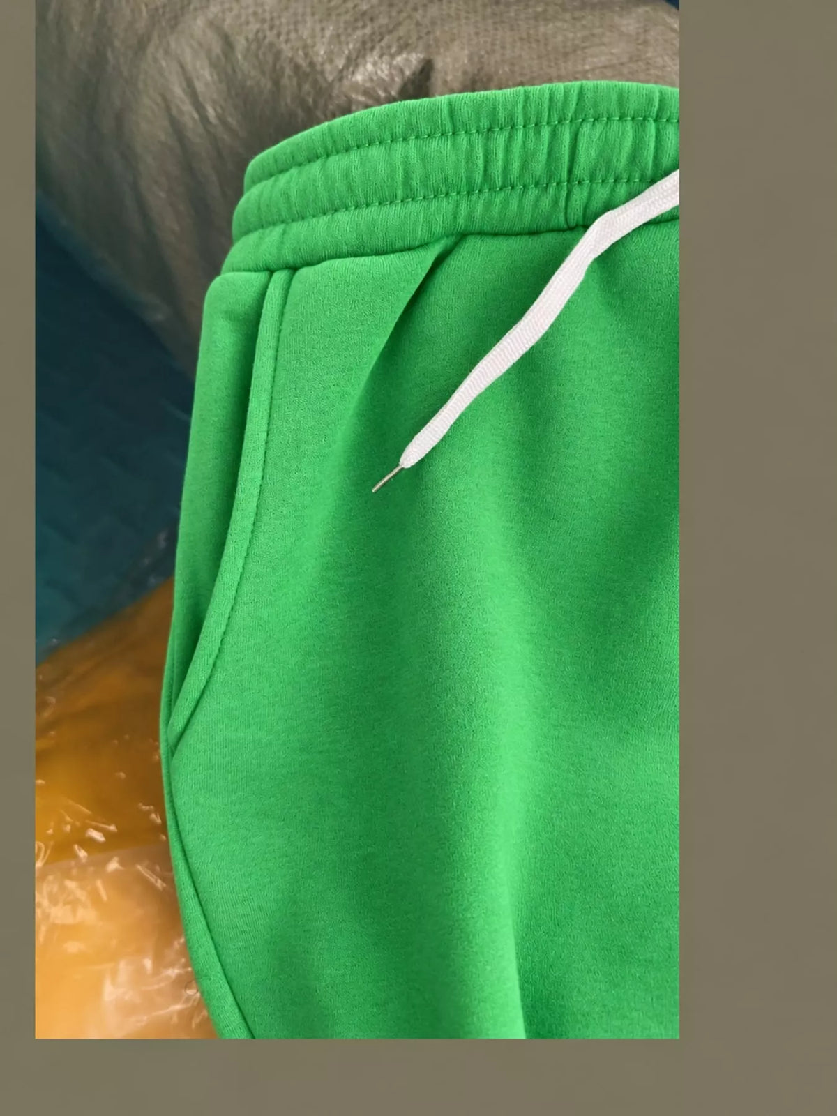 Green wide-leg pants with drawstring, detail view