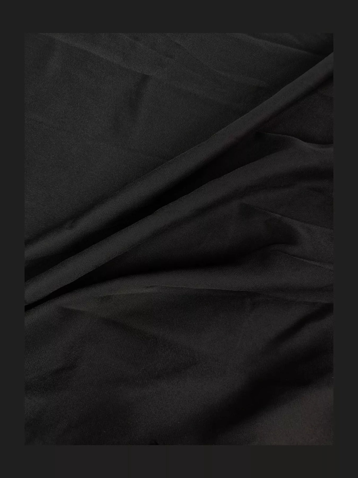 Black sleeveless high slit maxi dress, detail view